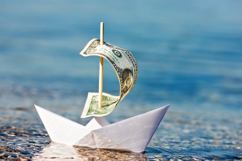 boat with dollar sail