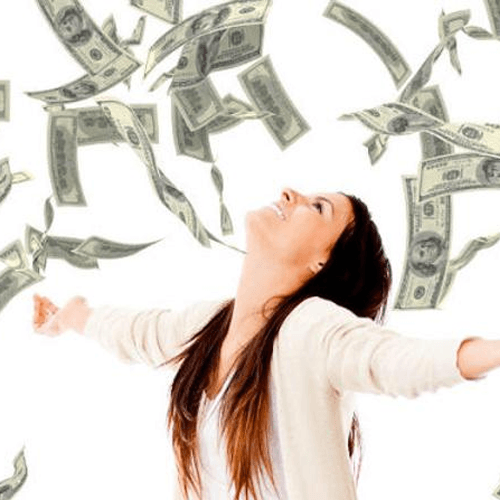 Woman standing under money raining