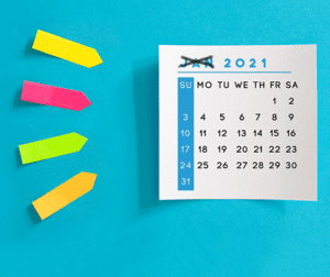 Post-its next to calendar with January crossed out